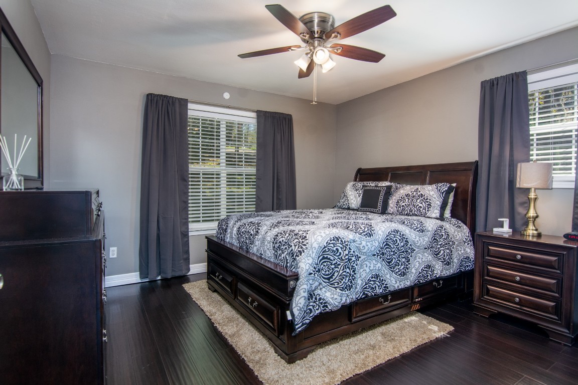 150 Edgewater Way Point Blank, TX 77364 - Photo 13 of 48 a bedroom with a bed and wooden floor