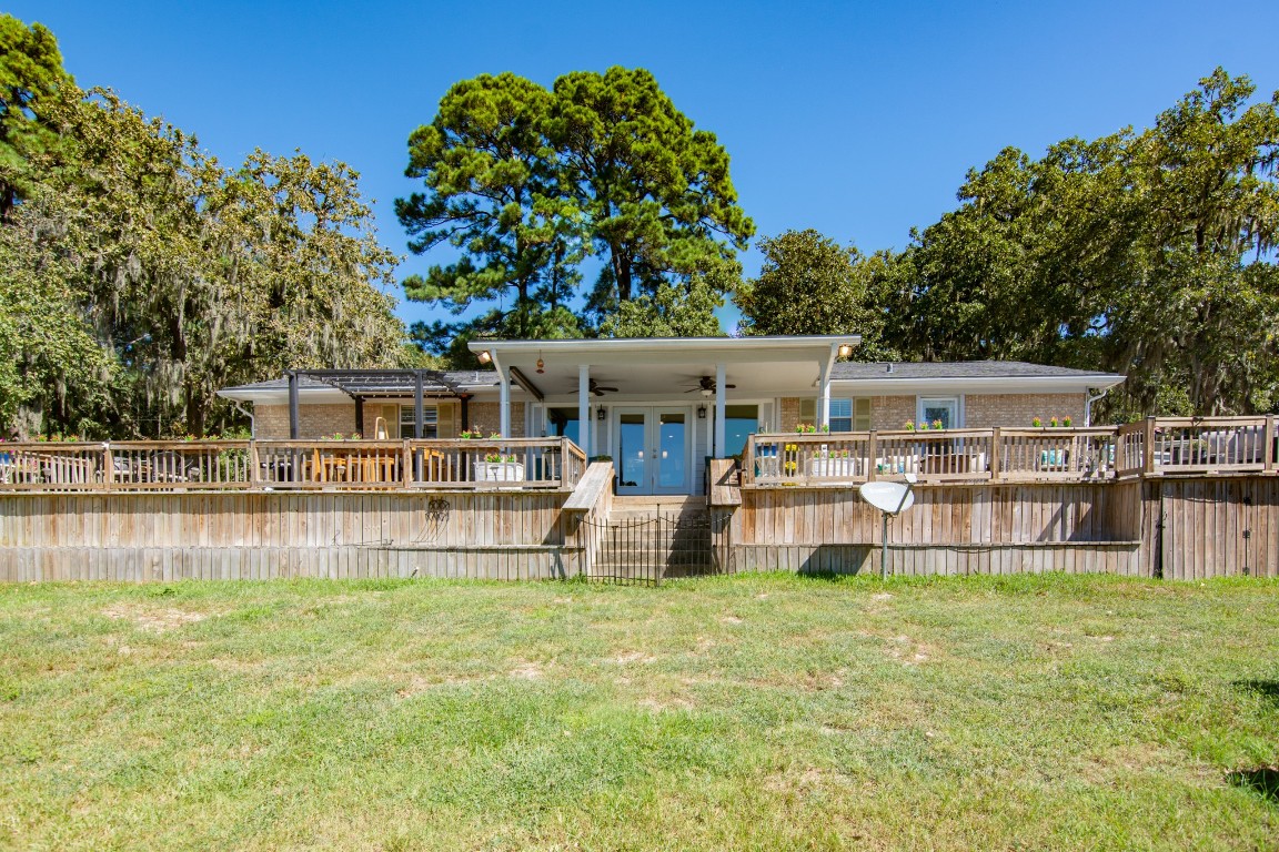 150 Edgewater Way Point Blank, TX 77364 - Photo 31 of 48 a view of a house with a big yard and sitting area