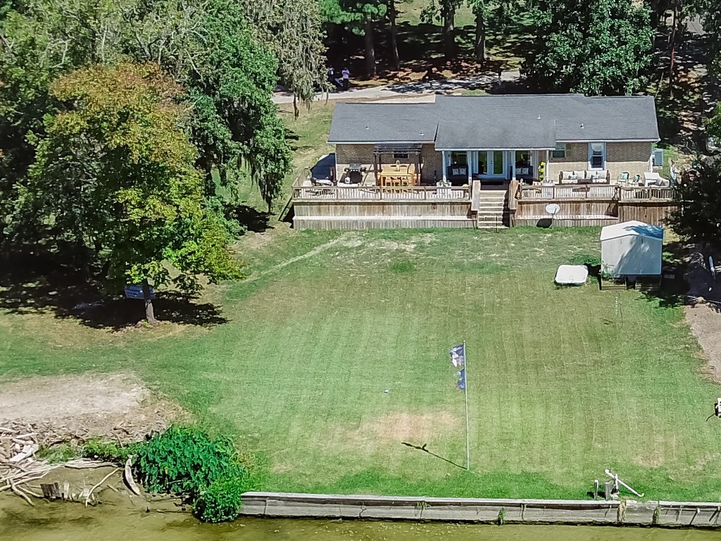 150 Edgewater Way Point Blank, TX 77364 - Photo 33 of 48 a house view with swimming pool and deck