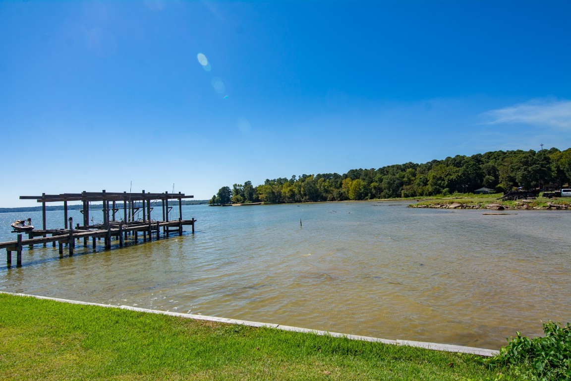 150 Edgewater Way Point Blank, TX 77364 - Photo 34 of 48 a view of a lake with houses in the back