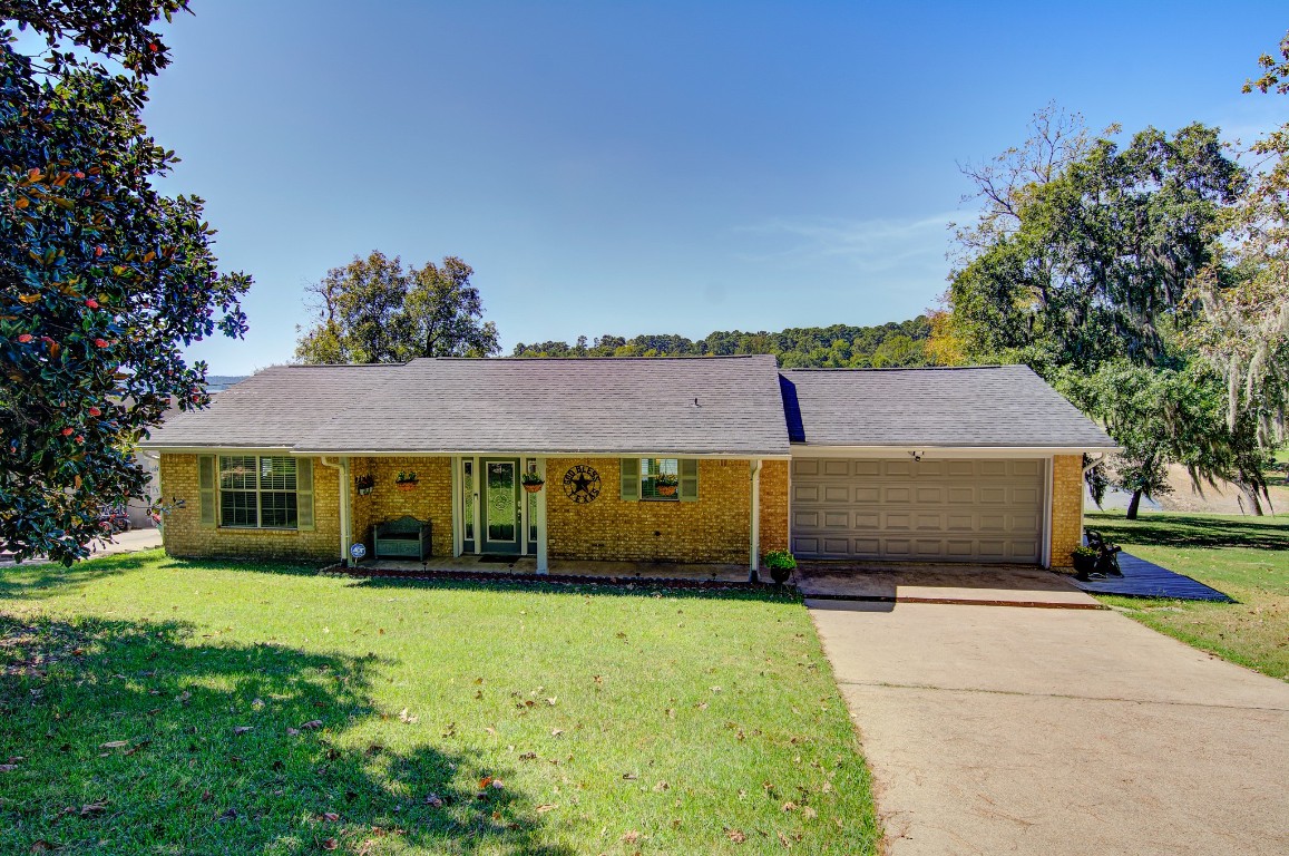150 Edgewater Way Point Blank, TX 77364 - Photo 39 of 48 a front view of a house with a yard