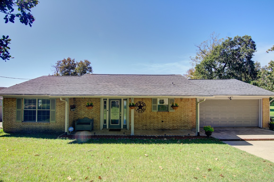 150 Edgewater Way Point Blank, TX 77364 - Photo 40 of 48 a view of a house with a yard