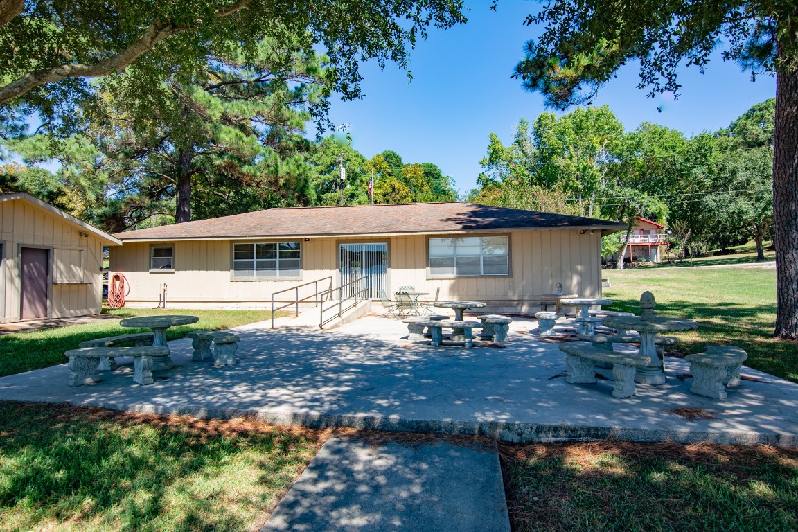 150 Edgewater Way Point Blank, TX 77364 - Photo 41 of 48 a view of a house with backyard and sitting area