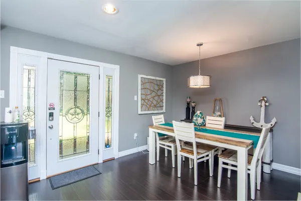 a dining room with furniture and window