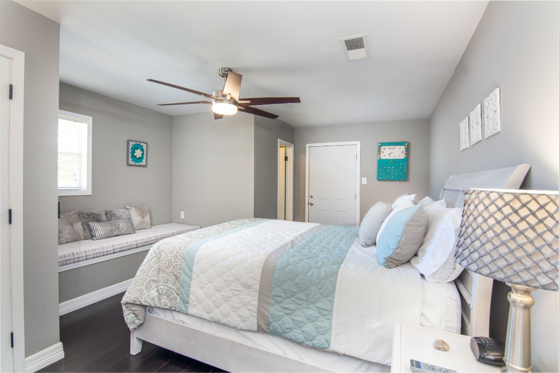 150 Edgewater Way Point Blank, TX 77364 - Photo 10 of 48 a bedroom with a bed and a chandelier