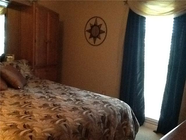 4111 Meadow View Circle Pleasant View, TN 37146 - Photo 11 of 16 a bed sitting in a bedroom next to a window