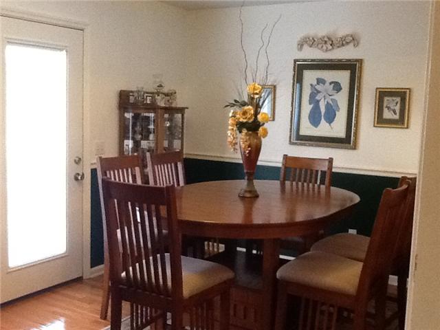 4111 Meadow View Circle Pleasant View, TN 37146 - Photo 5 of 16 a view of a dining room with furniture and wooden floor
