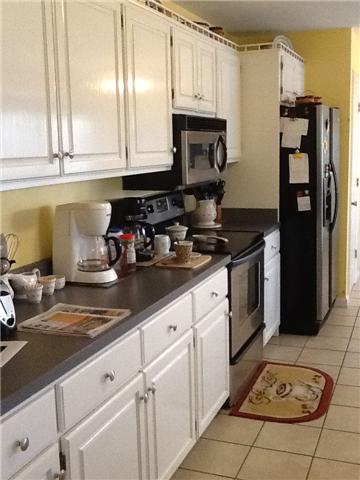 4111 Meadow View Circle Pleasant View, TN 37146 - Photo 6 of 16 a kitchen with stainless steel appliances granite countertop a sink stove and refrigerator