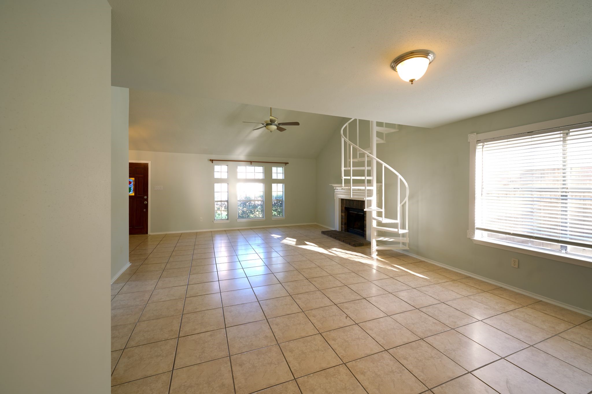 5838 North Magazine Circle Houston, TX 77084 - Photo 18 of 30 an empty room with windows and fireplace