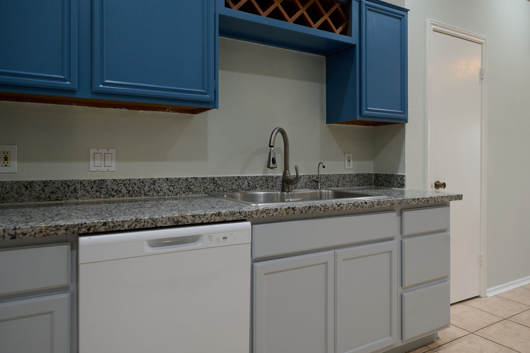 5838 North Magazine Circle Houston, TX 77084 - Photo 22 of 30 a kitchen with granite countertop white cabinets and a sink