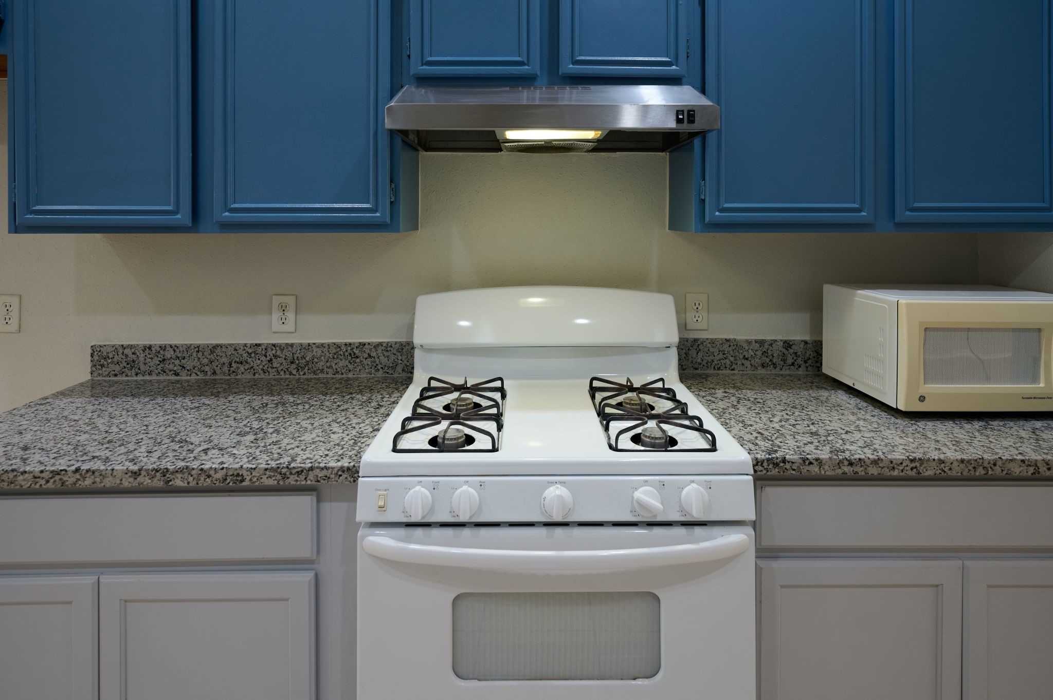 5838 North Magazine Circle Houston, TX 77084 - Photo 23 of 30 a kitchen with granite countertop cabinets and a stove top oven