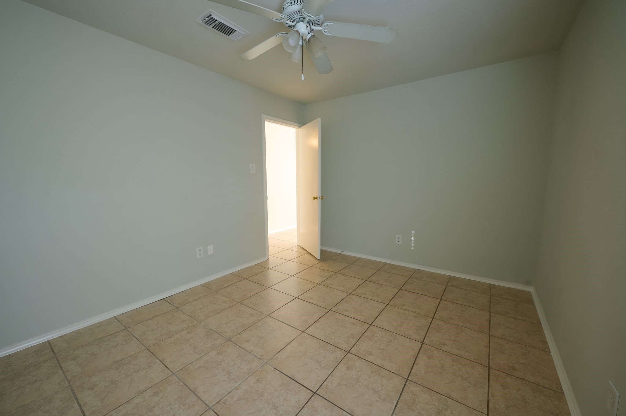 5838 North Magazine Circle Houston, TX 77084 - Photo 9 of 30 an empty room and chandelier fan