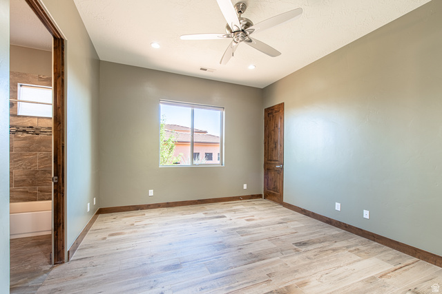 322 340 E Street Ivins, UT 84738 - Photo 33 of 61 Spacious room featuring wood-finish flooring, a ceiling fan, recessed lighting, and a window providing natural light