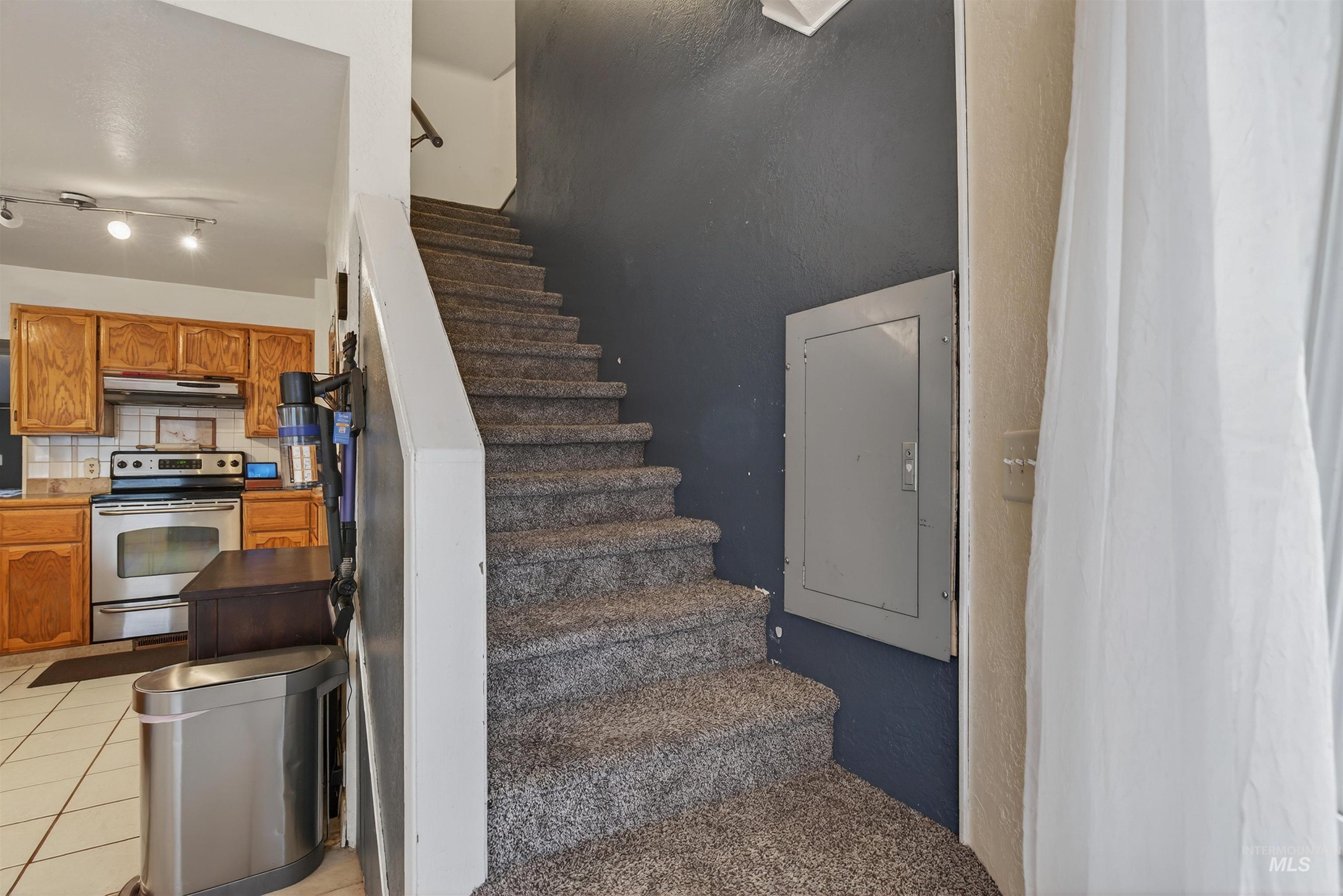 1266 Poplar Street Clarkston, WA 99403 - Photo 21 of 31 Stairs with tile patterned flooring
