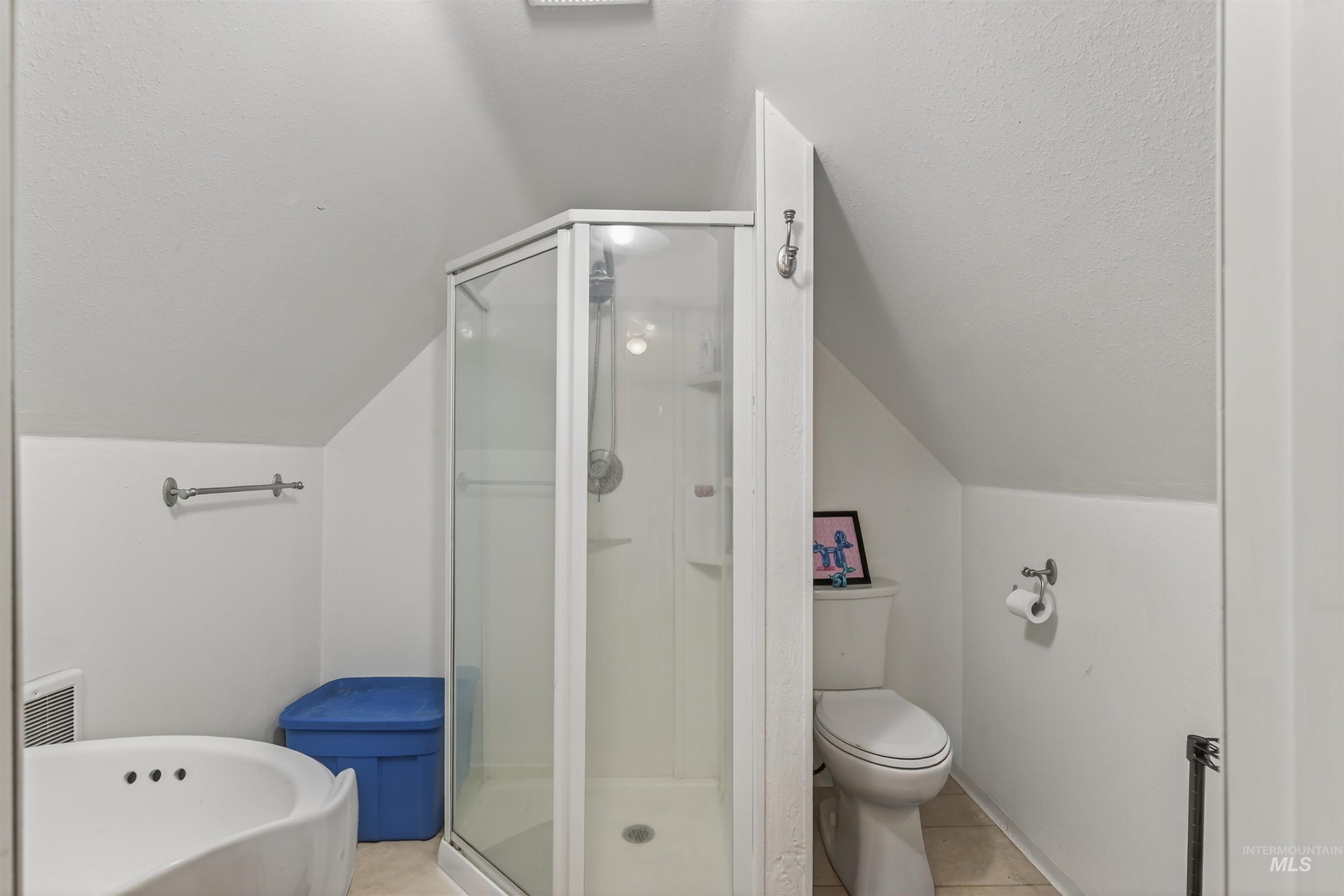 1266 Poplar Street Clarkston, WA 99403 - Photo 23 of 31 Bathroom featuring a shower stall and light tile patterned floors