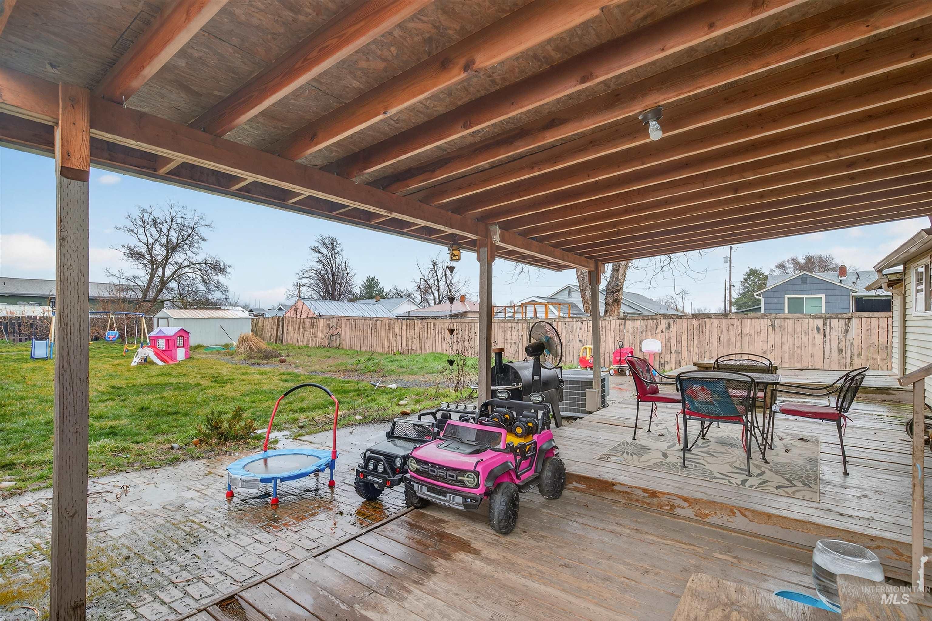 1266 Poplar Street Clarkston, WA 99403 - Photo 26 of 31 Wooden terrace featuring outdoor dining space and a fenced backyard