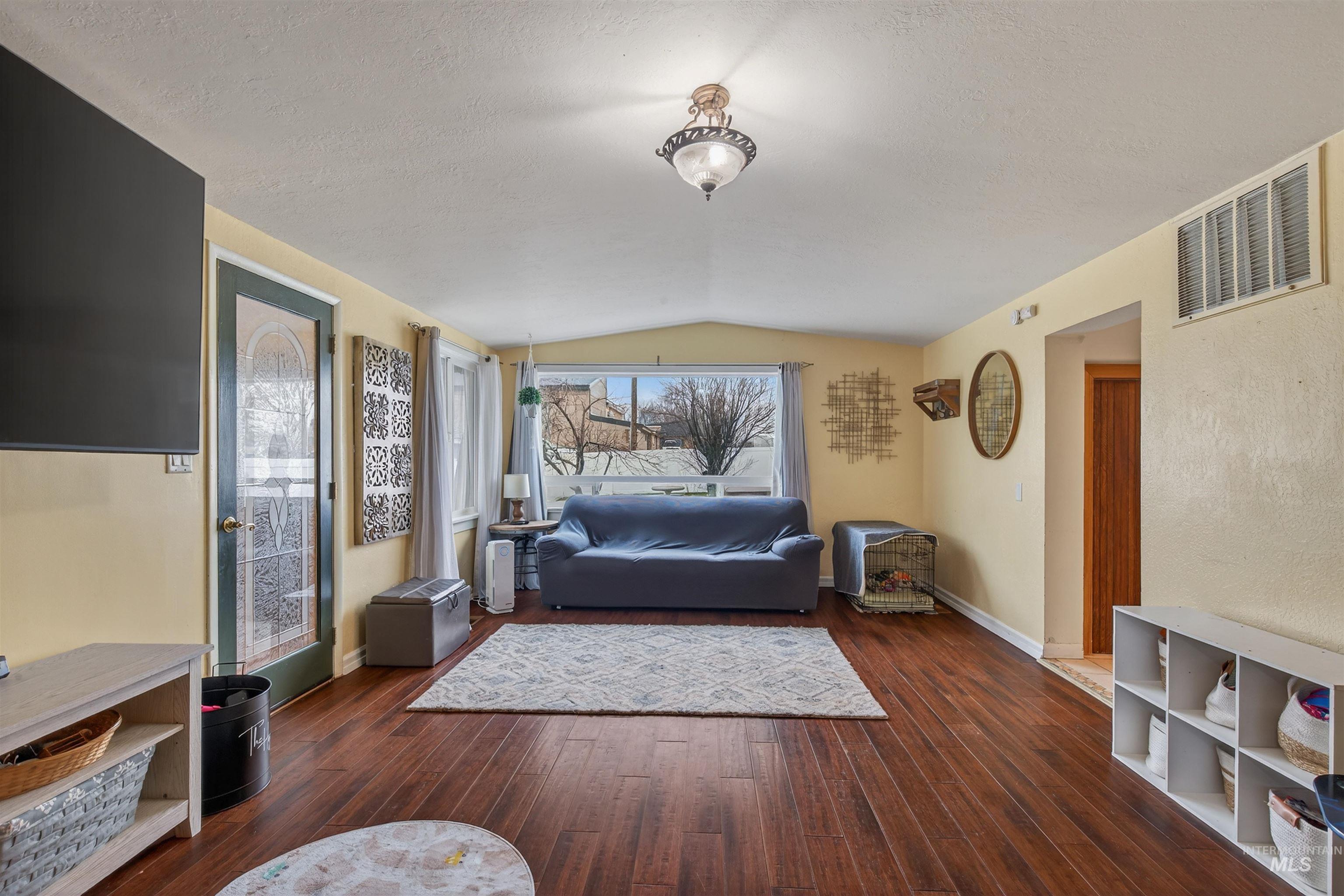 1266 Poplar Street Clarkston, WA 99403 - Photo 5 of 31 Living area with baseboards and dark wood finished floors