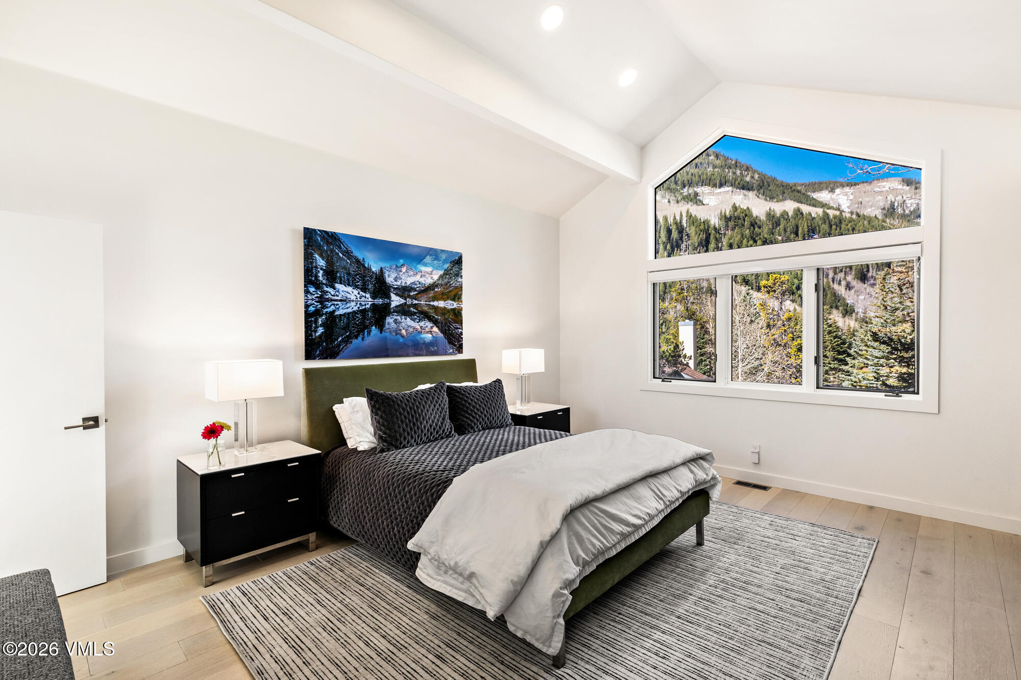 4515 Big Horn Road, Unit F Vail, CO 81657 - Photo 14 of 35 a bedroom with a bed and a large window