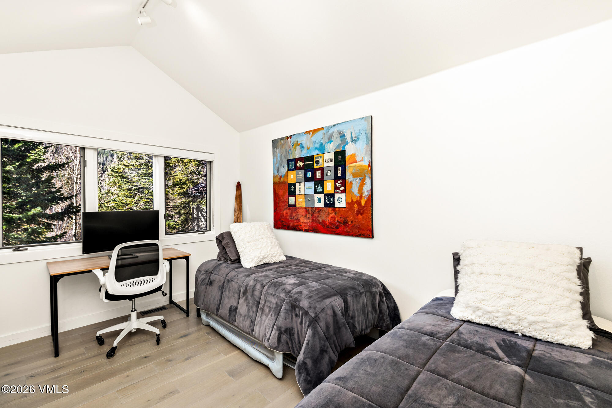 4515 Big Horn Road, Unit F Vail, CO 81657 - Photo 19 of 35 a bedroom with a bed and a window