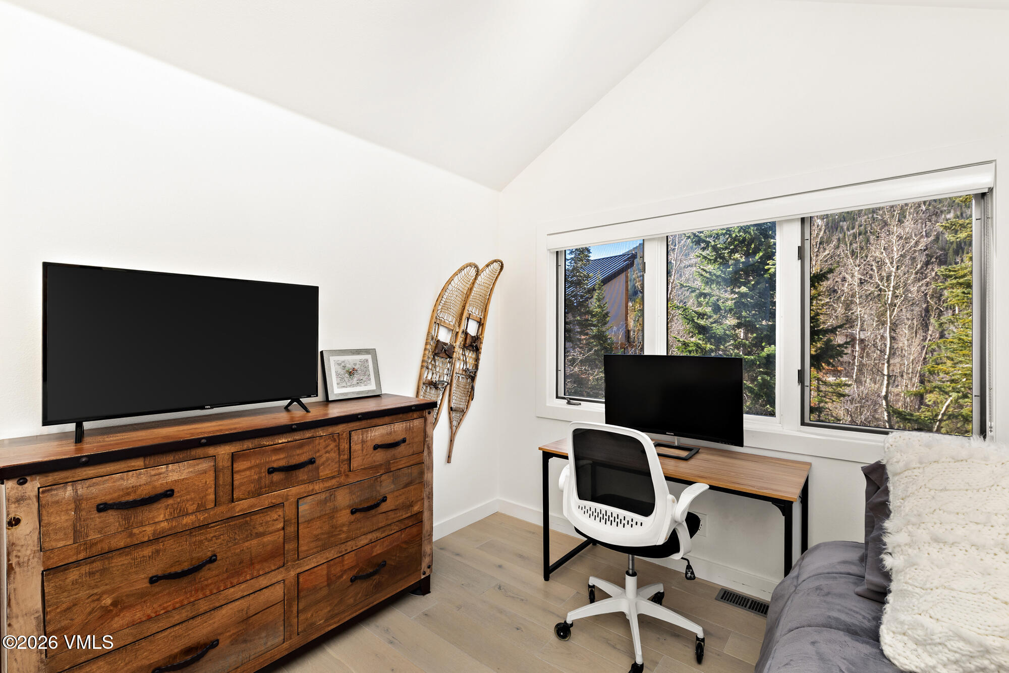 4515 Big Horn Road, Unit F Vail, CO 81657 - Photo 20 of 35 a view of a livingroom with workspace and a flat screen tv