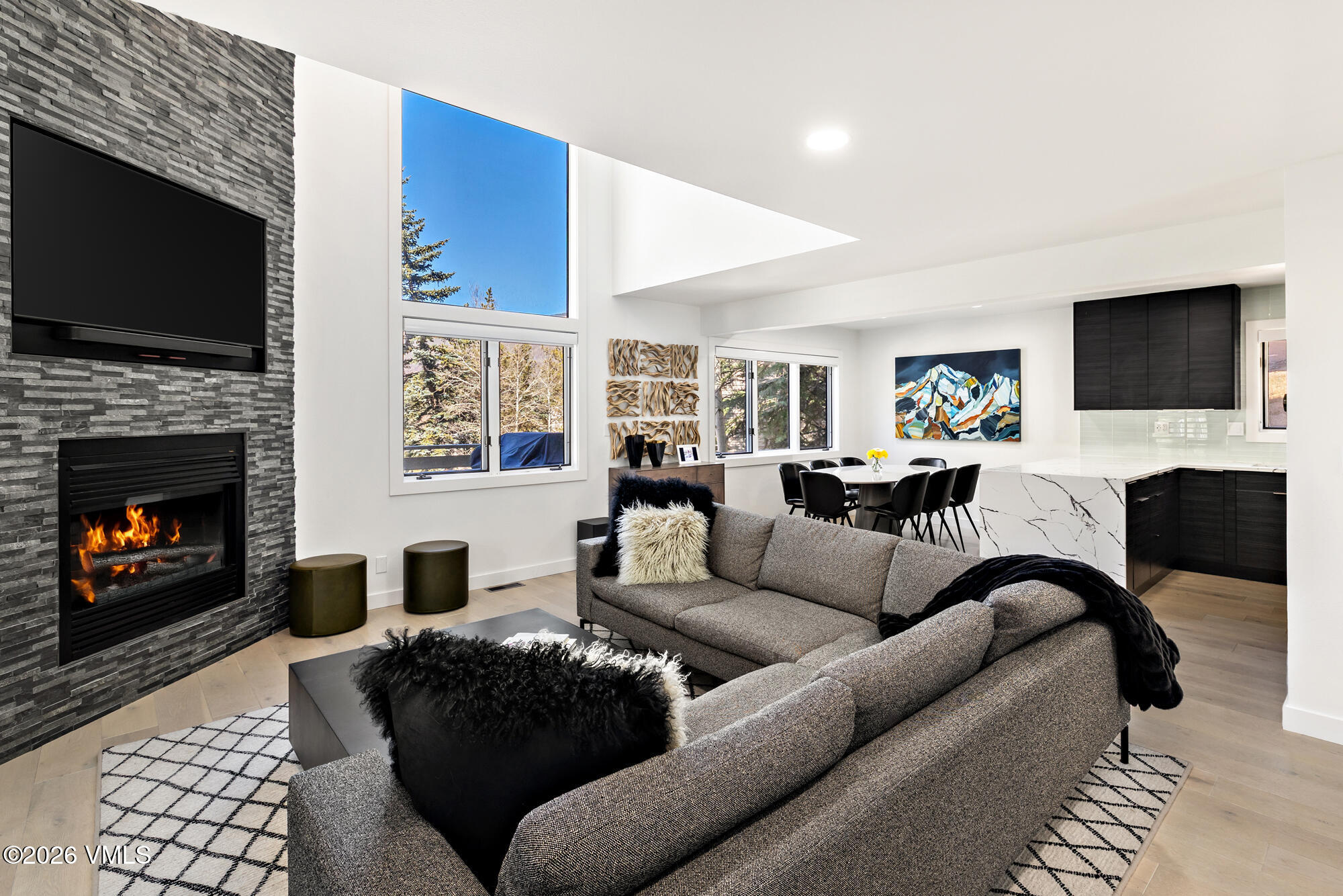 4515 Big Horn Road, Unit F Vail, CO 81657 - Photo 2 of 35 a living room with fireplace furniture and a flat screen tv