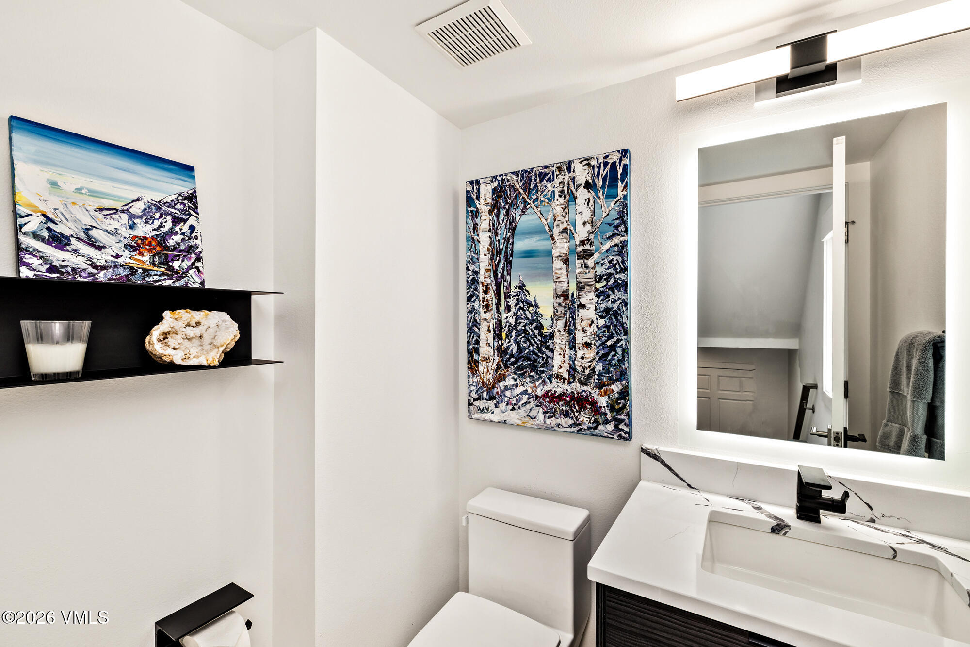 4515 Big Horn Road, Unit F Vail, CO 81657 - Photo 22 of 35 a bathroom with a sink mirror and vanity