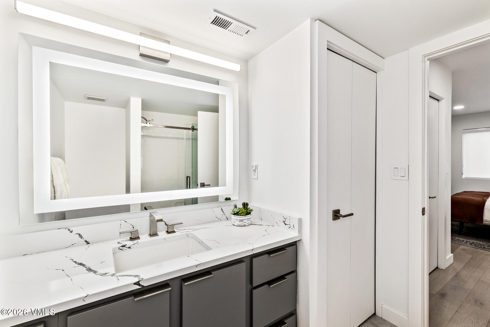 4515 Big Horn Road, Unit F Vail, CO 81657 - Photo 26 of 35 a bathroom with a sink and a mirror
