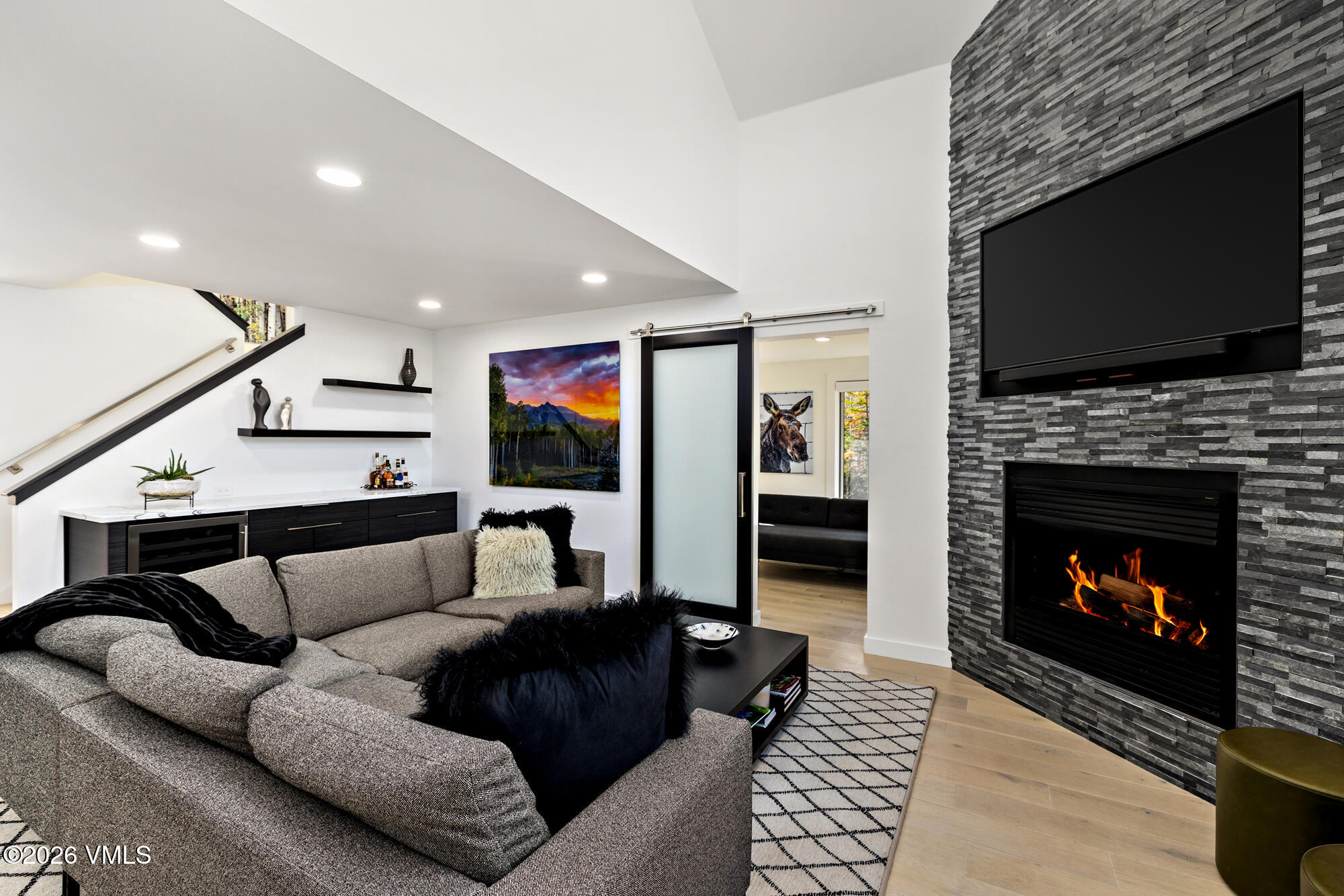 4515 Big Horn Road, Unit F Vail, CO 81657 - Photo 4 of 35 a living room with furniture a flat screen tv and a fireplace