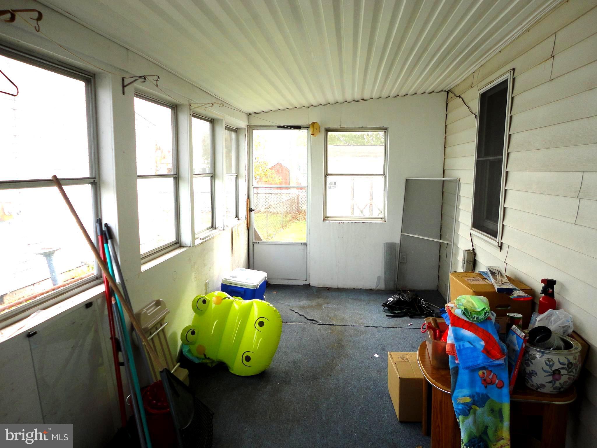 8201 Bullneck Road Baltimore, MD 21222 - Photo 11 of 33 Other side of sunroom with door to rear yard