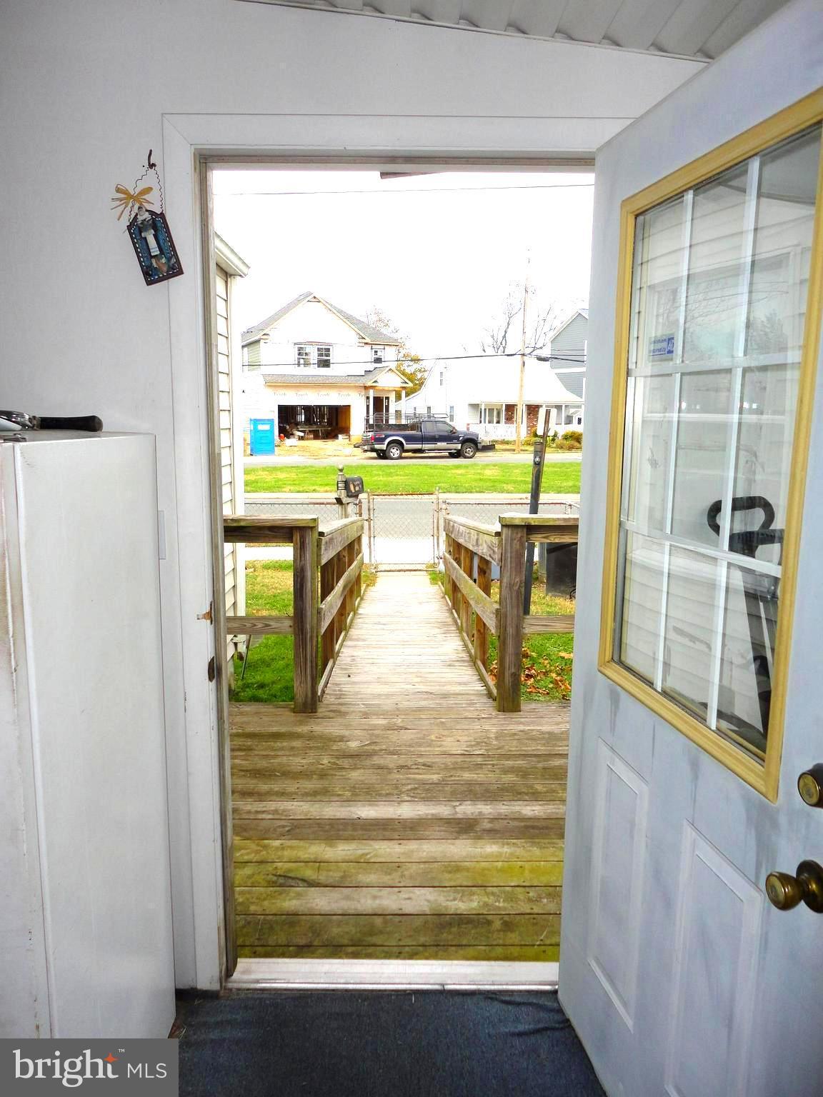 8201 Bullneck Road Baltimore, MD 21222 - Photo 12 of 33 Ramp from sidewalk leading to sunroom