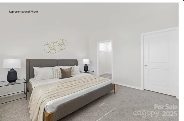 a bedroom with a bed and a wall painting