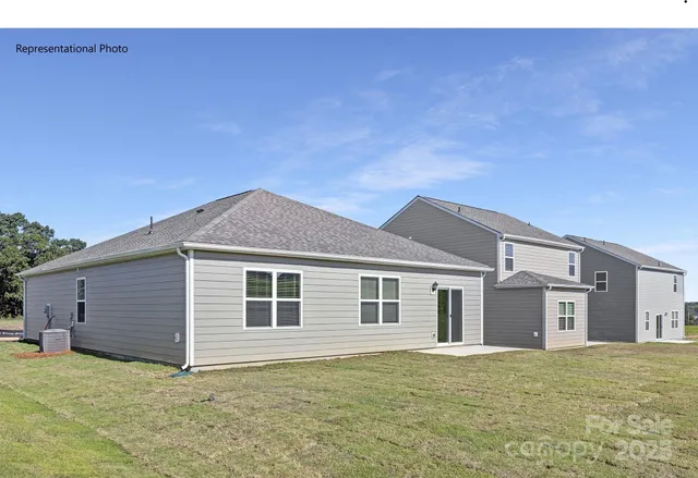 a big house with yard in front of it