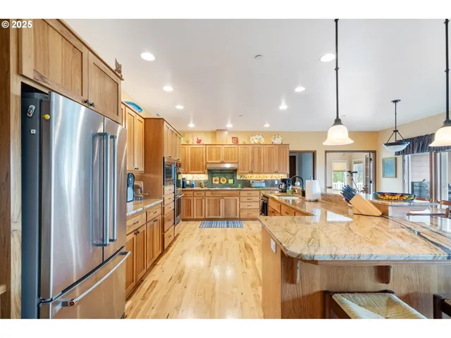 a lobby with furniture and a chandelier