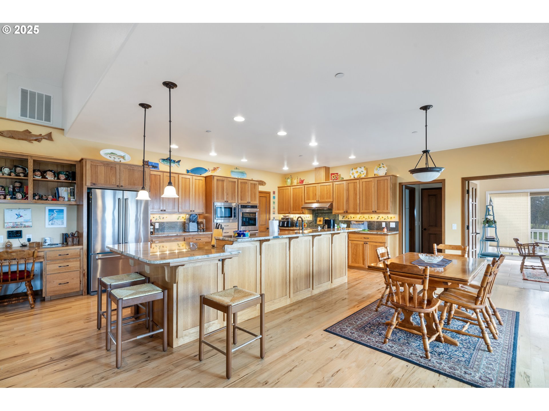 9500 Walz Hill Road Tillamook, OR 97141 - Photo 12 of 47 a dinning area with furniture and a chandelier