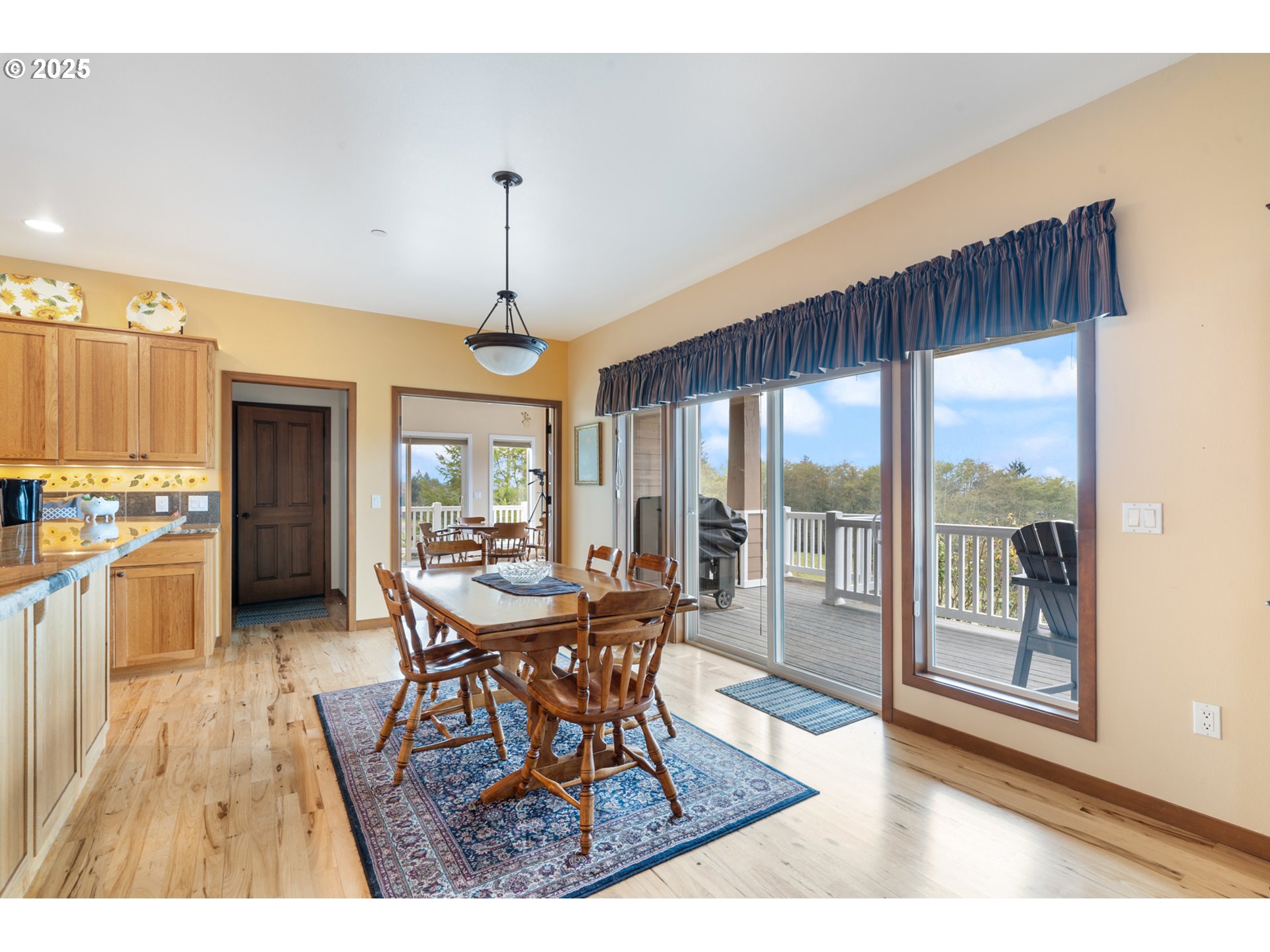 9500 Walz Hill Road Tillamook, OR 97141 - Photo 16 of 47 a view of a dining room with furniture window and wooden floor