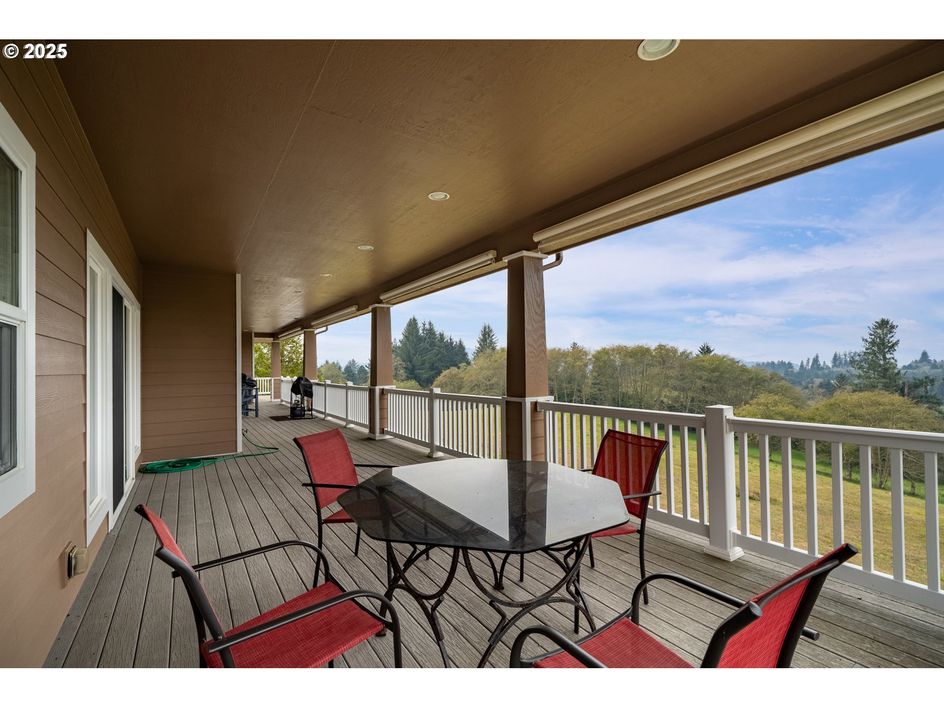 9500 Walz Hill Road Tillamook, OR 97141 - Photo 18 of 47 a view of a chairs and table in patio with a yard