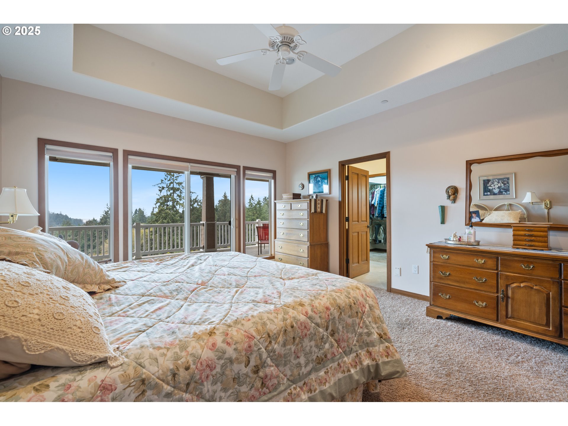 9500 Walz Hill Road Tillamook, OR 97141 - Photo 25 of 47 a bedroom with a large bed and a dresser