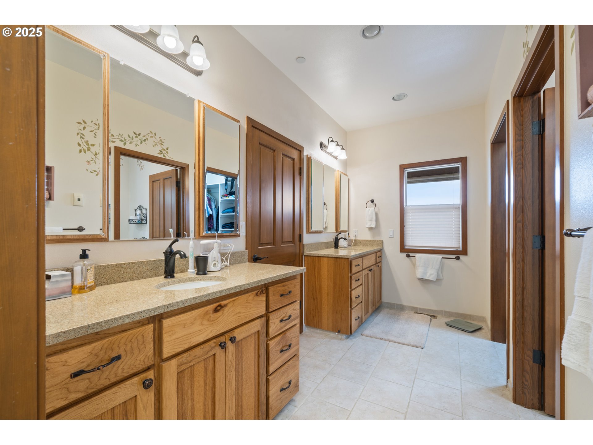 9500 Walz Hill Road Tillamook, OR 97141 - Photo 26 of 47 a spacious bathroom with a granite countertop sink mirror and a