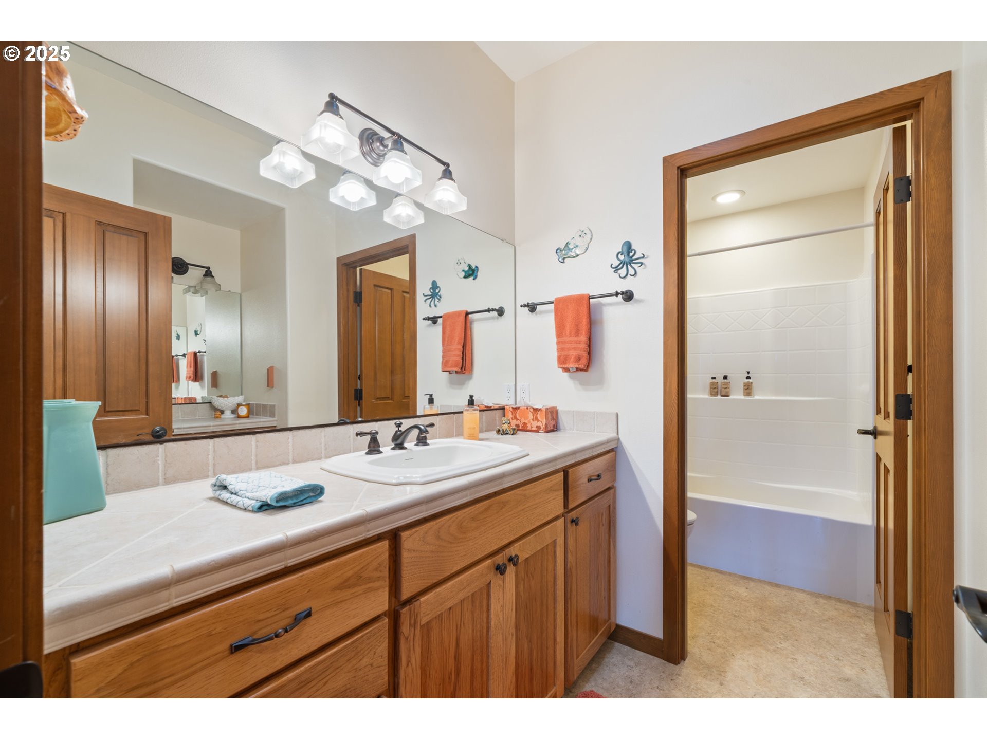 9500 Walz Hill Road Tillamook, OR 97141 - Photo 32 of 47 a bathroom with a sink a vanity and a mirror