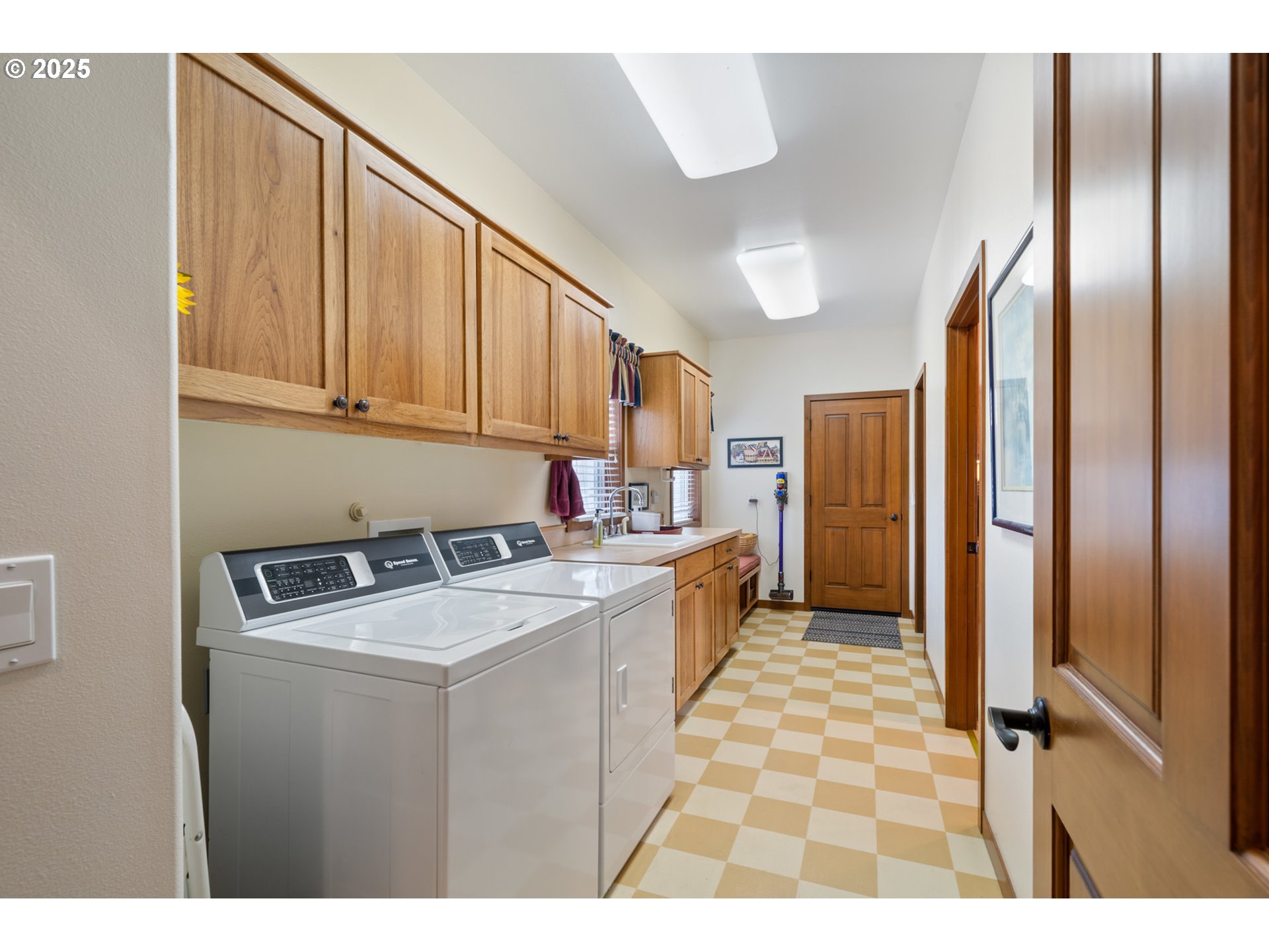 9500 Walz Hill Road Tillamook, OR 97141 - Photo 34 of 47 a kitchen with a refrigerator sink and cabinets