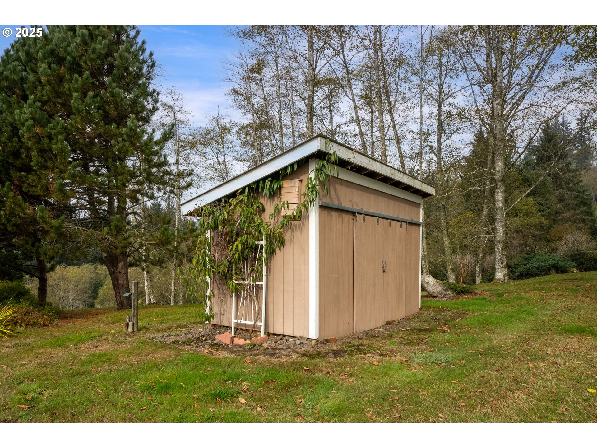 9500 Walz Hill Road Tillamook, OR 97141 - Photo 40 of 47 a backyard of a house with lots of green space