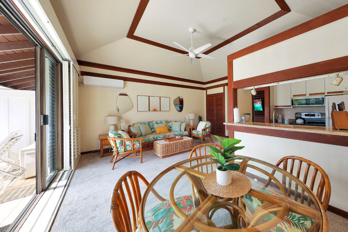 2253 Poipu Road, Unit 148 Koloa, HI 96756 - Photo 16 of 30 a dining room with furniture and a floor to ceiling window