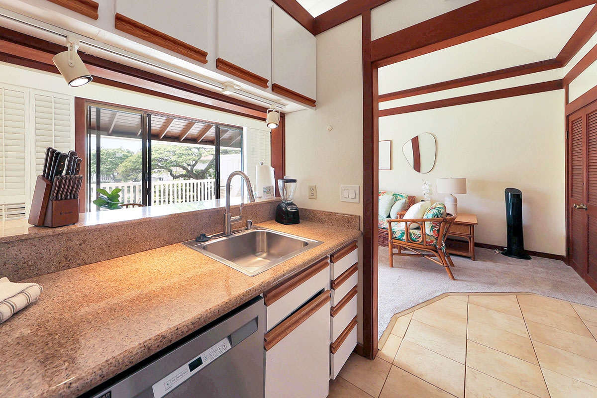 2253 Poipu Road, Unit 148 Koloa, HI 96756 - Photo 18 of 30 a kitchen with a sink and a large window