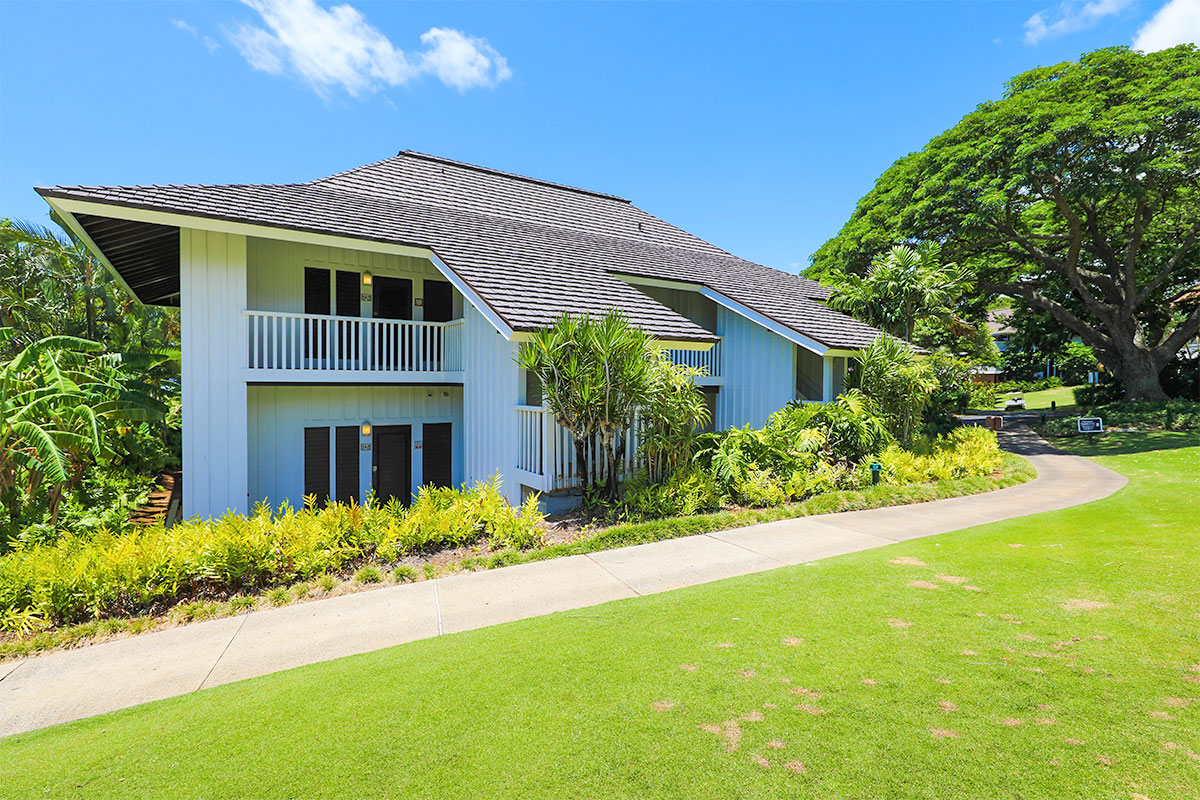 2253 Poipu Road, Unit 148 Koloa, HI 96756 - Photo 6 of 30 a front view of house with yard and trees in the background