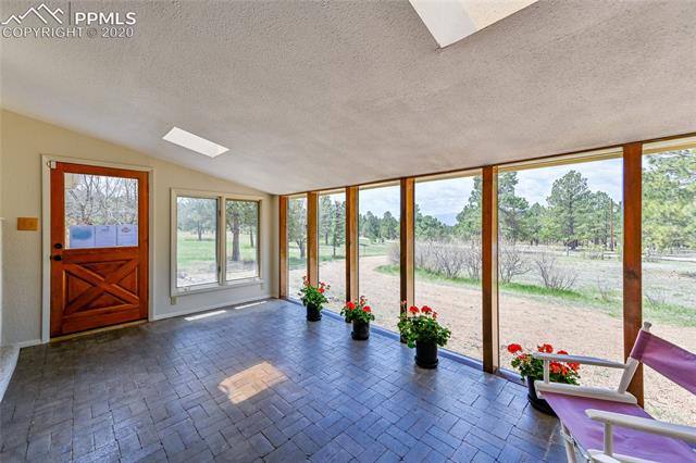 Front Sunroom with skylights, full windows, brick floor for passive solar.