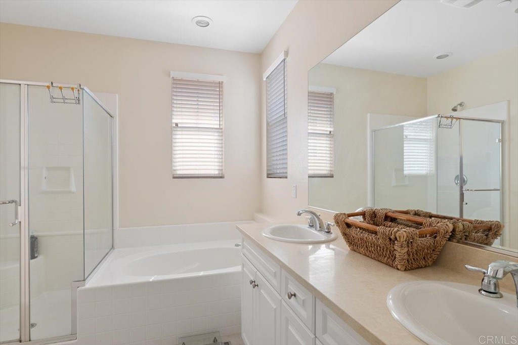 1347 Dolomite Way San Marcos, CA 92078 - Photo 13 of 23 a spacious bathroom with a tub sink and mirror