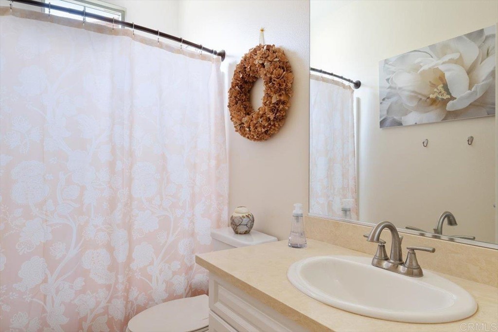 1347 Dolomite Way San Marcos, CA 92078 - Photo 16 of 23 a bathroom with a sink and a mirror