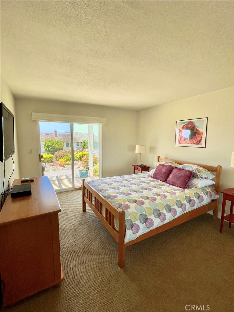 33581 Moonsail Drive Dana Point, CA 92629 - Photo 16 of 29 a bedroom with a bed and a flat screen tv