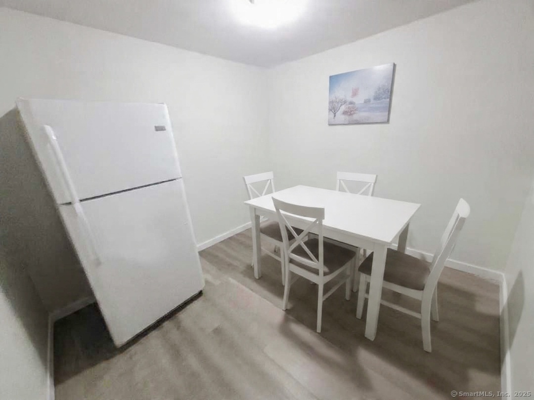 27 Paper Mill Road New Milford, CT 06776 - Photo 14 of 20 a view of a room with furniture and a refrigerator