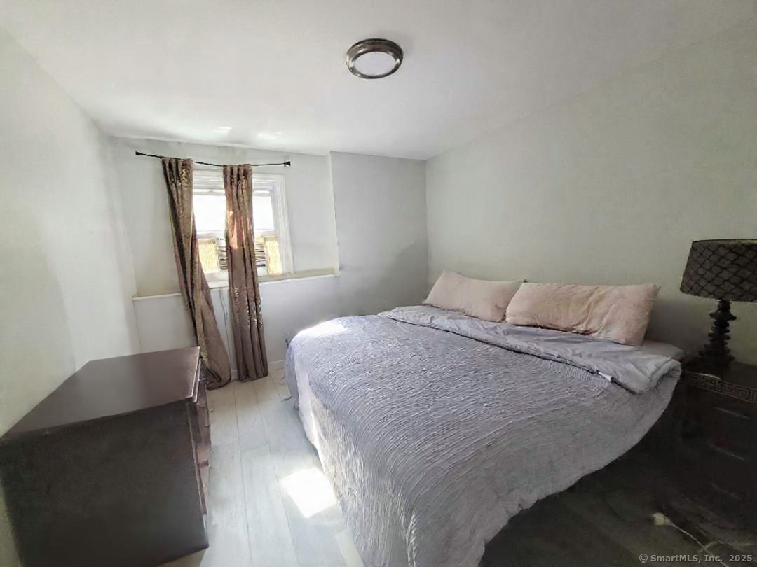 27 Paper Mill Road New Milford, CT 06776 - Photo 16 of 20 a bedroom with a bed and a window